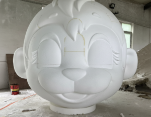 Large-scale 3D-printed mascot (raw assembly stage) in MorphicFab workshop
